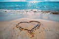 A romantic love heart drawn in the sand on a beautiful beach Royalty Free Stock Photo