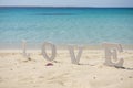 Romantic love sign on a tropical beach paradise Royalty Free Stock Photo