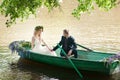 Romantic love story in boat. Woman with wreath and white dress. European tradition Royalty Free Stock Photo