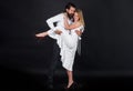 Romantic lovers couple dancing. Professional tango dancers. Ballroom dance. Passion and love. Royalty Free Stock Photo