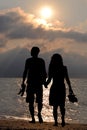 Romantic lovers walking on the beach