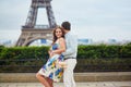 Romantic loving couple having a date near the Eiffel tower Royalty Free Stock Photo