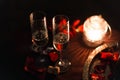 Romantic luxury evening with champagne setting with two glasses, rose petails and candles Royalty Free Stock Photo