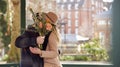 Romantic Man Hugging Young Woman With Faces Hidden Behind A Bouquet Of Flowers He Gives Her Royalty Free Stock Photo