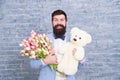 Romantic man. Macho getting ready romantic date. Waiting for darling. Man well groomed wear tuxedo bow tie hold flowers Royalty Free Stock Photo