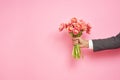 Romantic man presents a bouquet of tulips Royalty Free Stock Photo