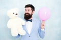 Romantic man with teddy bear and party balloon. surprise for his girlfriend. holiday celebration concept. romantic man Royalty Free Stock Photo