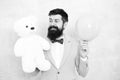 Romantic man with teddy bear and party balloon. surprise for his girlfriend. holiday celebration concept. romantic man Royalty Free Stock Photo