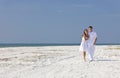 Romantic Man & Woman Couple Walking on An Beach Royalty Free Stock Photo