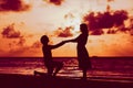 Marriage proposal at sunset beach Royalty Free Stock Photo