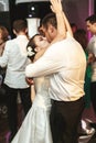 Romantic married couple bride and groom dancing at wedding reception in france