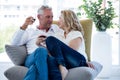 Romantic mature couple having red wine at home Royalty Free Stock Photo