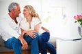 Romantic mature couple sitting face to face Royalty Free Stock Photo