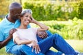 Romantic Mature Couple Sitting In Garden