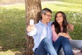 Romantic Mature Couple Taking Selfie On Smartphone While Relaxing In Park Together Royalty Free Stock Photo