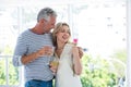 Romantic mature couple with wine glasses and rose Royalty Free Stock Photo