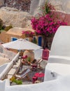 Romantic mediterraen vacation on a rooftop over the sea in Santorini with Bougainvillea flower Royalty Free Stock Photo