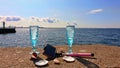 Beautiful nature vacation  romantic  summer  at sunset seascape two blue glasses of Champagne  living  coral blue white color wild Royalty Free Stock Photo