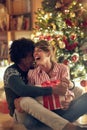 Romantic man and woman opening a present on a Christmas Royalty Free Stock Photo