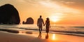 Romantic middle aged couple enjoying beautiful sunset walk on the beach travel vacation, Krabi Thailand