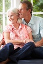 Romantic Middle Aged Couple Looking Out Of Window Royalty Free Stock Photo