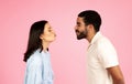 Romantic millennial couple reaching each other with kissing lips Royalty Free Stock Photo