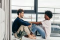 Romantic mixed race couple standing by the window thinking about their future. Royalty Free Stock Photo