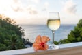 Romantic moments in summer at sunset with two glasses of white wine - Relaxing romantic holiday concept with beautiful view of Royalty Free Stock Photo