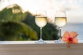 Romantic moments in summer at sunset with two glasses of white wine - Relaxing romantic holiday concept with beautiful view of Royalty Free Stock Photo