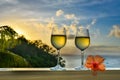 Romantic moments in summer at sunset with two glasses of white wine - Relaxing romantic holiday concept with beautiful view of Royalty Free Stock Photo