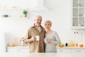 Romantic morning, happy relationship and adult couple drinking coffee at home Royalty Free Stock Photo