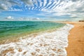 Romantic morning landscape on a tropical sea coast with azure sea and white foam