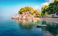 Romantic morning seascape of Adriatic sea. Colorful summer view of small beach in famous resort - Brela, Croatia, Europe. Royalty Free Stock Photo