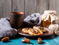 Romantic morning still life, in a rustic style with cookies, a glass jar of honey