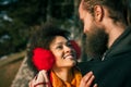 Romantic multiethnic couple in love hugging on the street Royalty Free Stock Photo