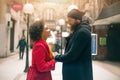 Romantic multiethnic couple in love hugging on the street Royalty Free Stock Photo