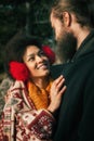 Romantic multiethnic couple in love hugging on the street Royalty Free Stock Photo