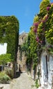 Romantic narrow uphill street in Bussana Vecchia, Liguria, Italy