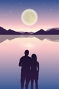 Romantic night couple in love at the sea with full moon and starry sky Royalty Free Stock Photo