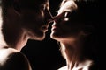 Romantic night date. Close up face of sensual portrait of a sexy couple embracing while dating. Young couple in love on