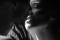 Romantic night date. Close up portrait of man embracing and going to kiss sensual woman. Loving couple kissing over Royalty Free Stock Photo