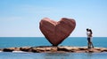 Romantic Oasis, Couples on a Heart Shaped Rock in the Midst of the Sea, a Symbol of Everlasting Love