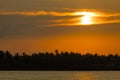 Sunset on palm trees island of Maldives