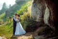 Romantic outdoor wedding portrait. Stylish newlyweds are hugging and standing head-to-head to each other on the sunny