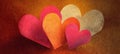 Romantic Overlapping Brush-Painted Hearts with Textured Warm Design Royalty Free Stock Photo