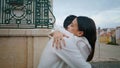 Romantic pair embracing at city closeup. Married people enjoying wedding day