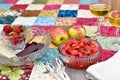 Romantic patio setting for relaxing warm summer evening outdoor picnic in beautifully landscaped garden Royalty Free Stock Photo