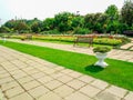 Romantic Peaceful Garden with Colorful Flowers and Metal Benches