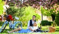 Romantic picnic. Anniversary concept. Idyllic moment. Man and woman in love. Picnic time. Spring date. Playful couple Royalty Free Stock Photo