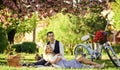 Romantic picnic. Anniversary concept. Idyllic moment. Man and woman in love. Picnic time. Spring date. Playful couple Royalty Free Stock Photo